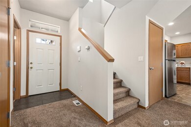 Tile-floored entries offer a clean and inviting welcome.