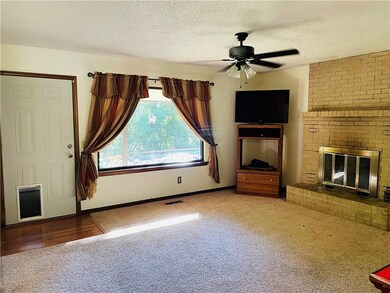 Living room with wood burning fireplace