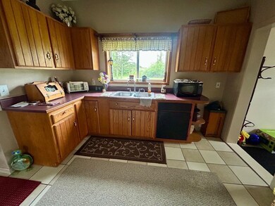One side of the kitchen with plenty of storage and