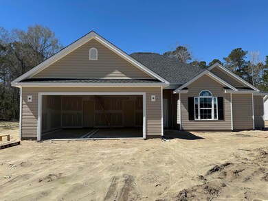 View of front of property featuring an attached ga