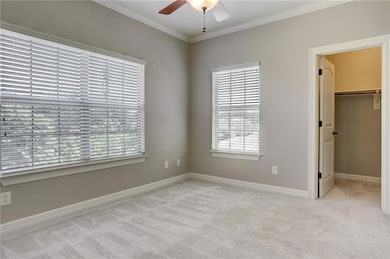Unfurnished bedroom featuring carpet flooring, cr