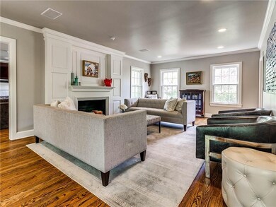 This living area features a fireplace boasting ori