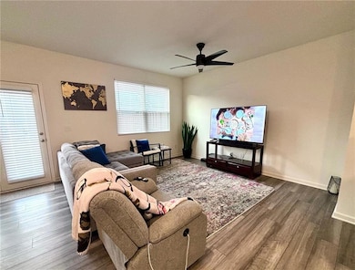 Living room featuring dark wood-type flooring and 