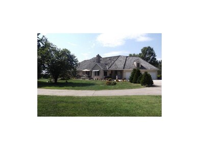 VIEW FROM BACK WITH 3 CAR ATTACHED GARAGE