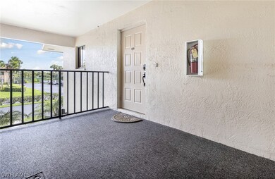 View of exterior entry with a balcony