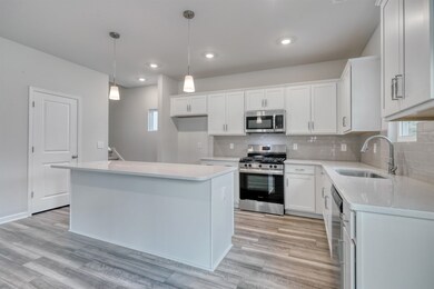 Kitchen with appliances with stainless steel finis