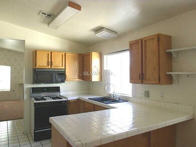 Property Photo. Kitchen has tile flooring and tile