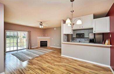 Dining to Kitchen, Living and Sliders to Patio