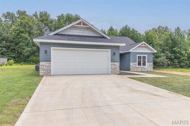 Craftsman house featuring stone siding, roof with shingles, and a front lawn