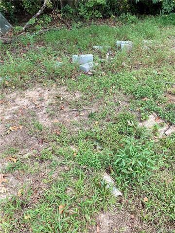 Shows pipe/entrance to septic tank.
