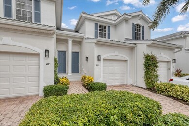 View of front facade featuring a garage, decorativ
