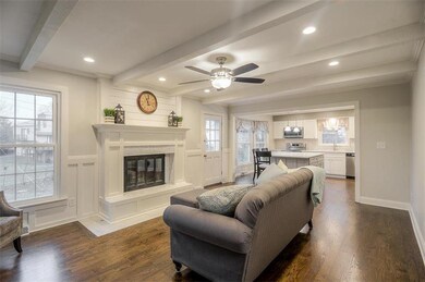 Spacious hearth room opens to gleaming new kitchen