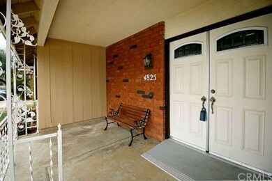 Covered front porch with double door entry