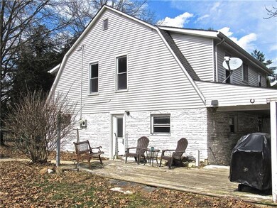 Wood deck (needs repair) offers sunny entertaining