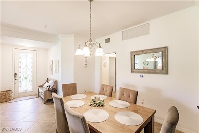 Dining area with ornamental molding, an inviting c