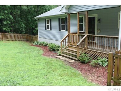 Landscaped, fenced front yard
