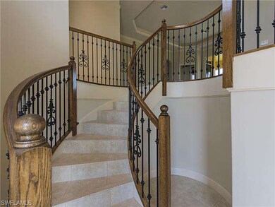Winding Spiral Stairway Leads to the Open Floor Pl