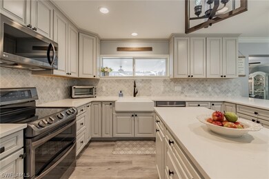 Quartz counter tops with full backsplash.