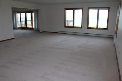 This spacious living room has multi views of the l