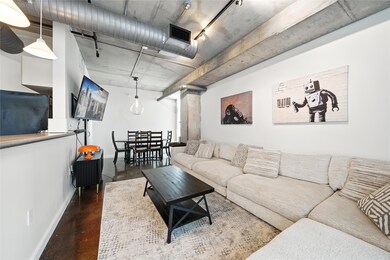 The cozy living room with a view of the dining roo