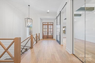 Foyer and Den with Glass Corner Detail