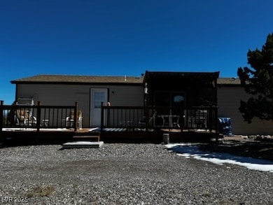 Back of house with a wooden deck
