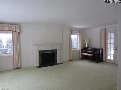 Living Room large windows/FP and French doors to s