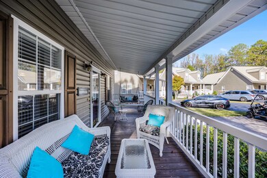 Wooden deck featuring covered porch