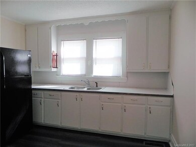Another view of kitchen.  Refrigerator remains wit