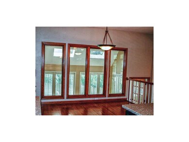 Open eat in space overlooks the sun room.