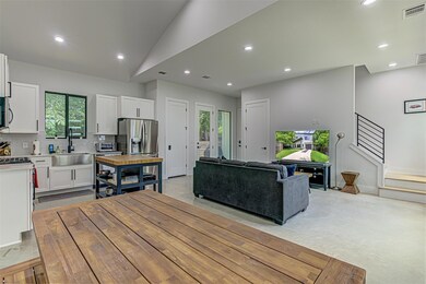 Living area featuring recessed lighting and vault