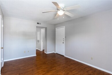 Spare room featuring visible vents, baseboards, ce