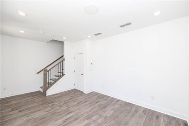Great space to utilize as a home office, second family room area and more- slider open up to make a continuous space with your covered front terrace