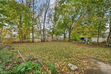 View of fenced backyard