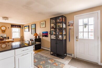 The kitchen offers tile flooring throughout. The side door leads out to the deck, it's a great flow.