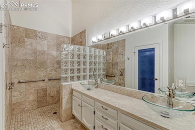 Master bath with luxury tile, walk-in shower and d