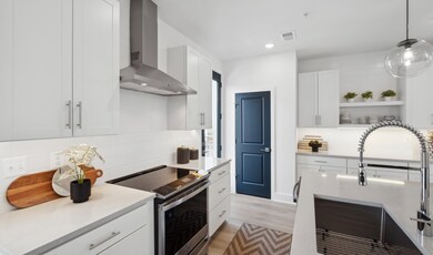 Kitchen with stainless steel hood