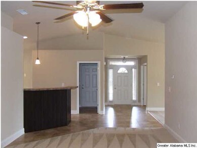 LIVING ROOM LOOKING TOWARDS FOYER SHOWING BREAKFAS