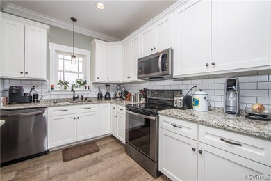 kitchen with stainless steel appliances, granite c