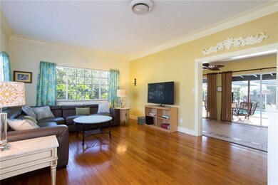 Cove Ceilings and Original Hardwoods in the Living