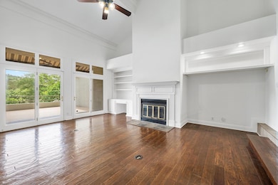 Unfurnished living room with a glass covered fire