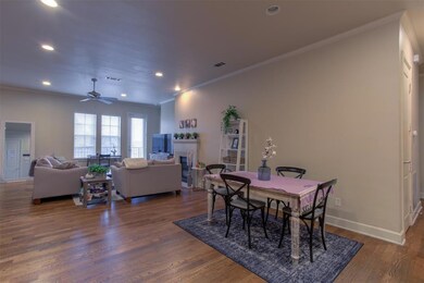 Dining area and living room are open and airy.