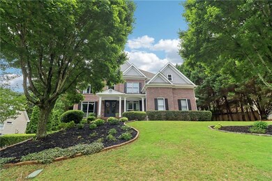View of front of house featuring brick siding and a front lawn