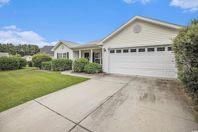 Ranch-style home with driveway, a front lawn, a porch, an attached garage, and roof with shingles