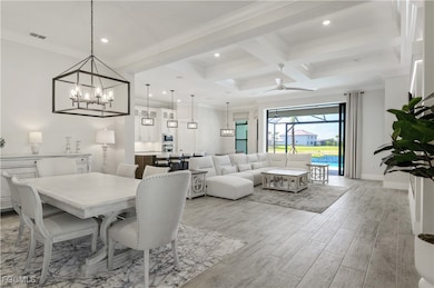 Dining area featuring ceiling fan, light wood-styl