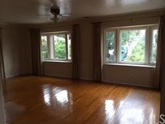 gorgeous hardwood floors and beautiful bay windows