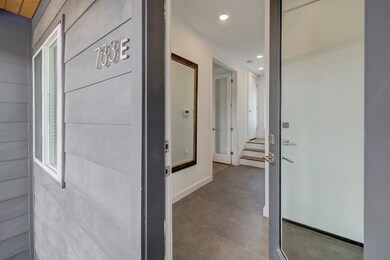 A wide entry hall with direct access to the garage