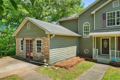 View of front of home featuring a shingled roof an