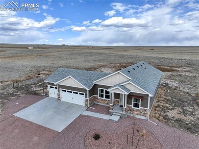 3-car attached garage with concrete driveway.