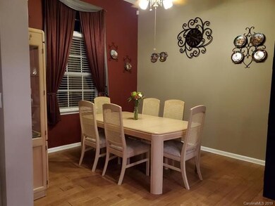 Formal dining room with 12' ceiling and ceiling fa